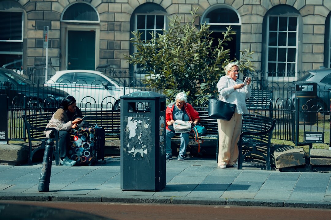 elderly people reading newspaper