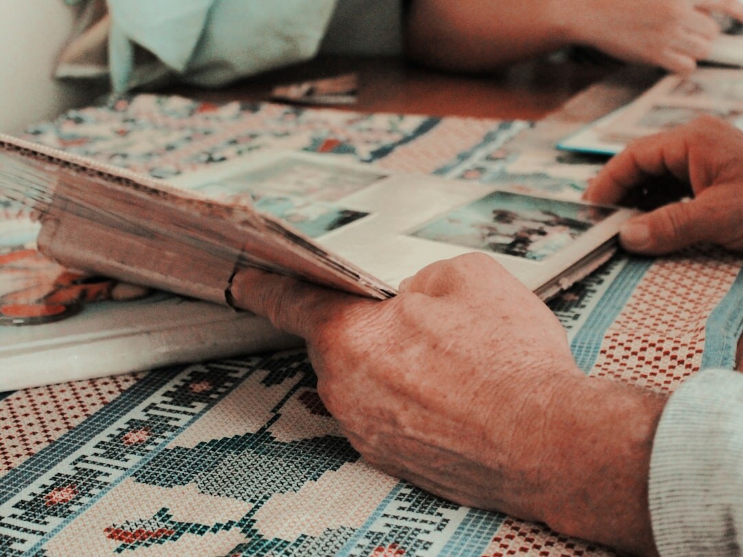 elderly people reading newspaper